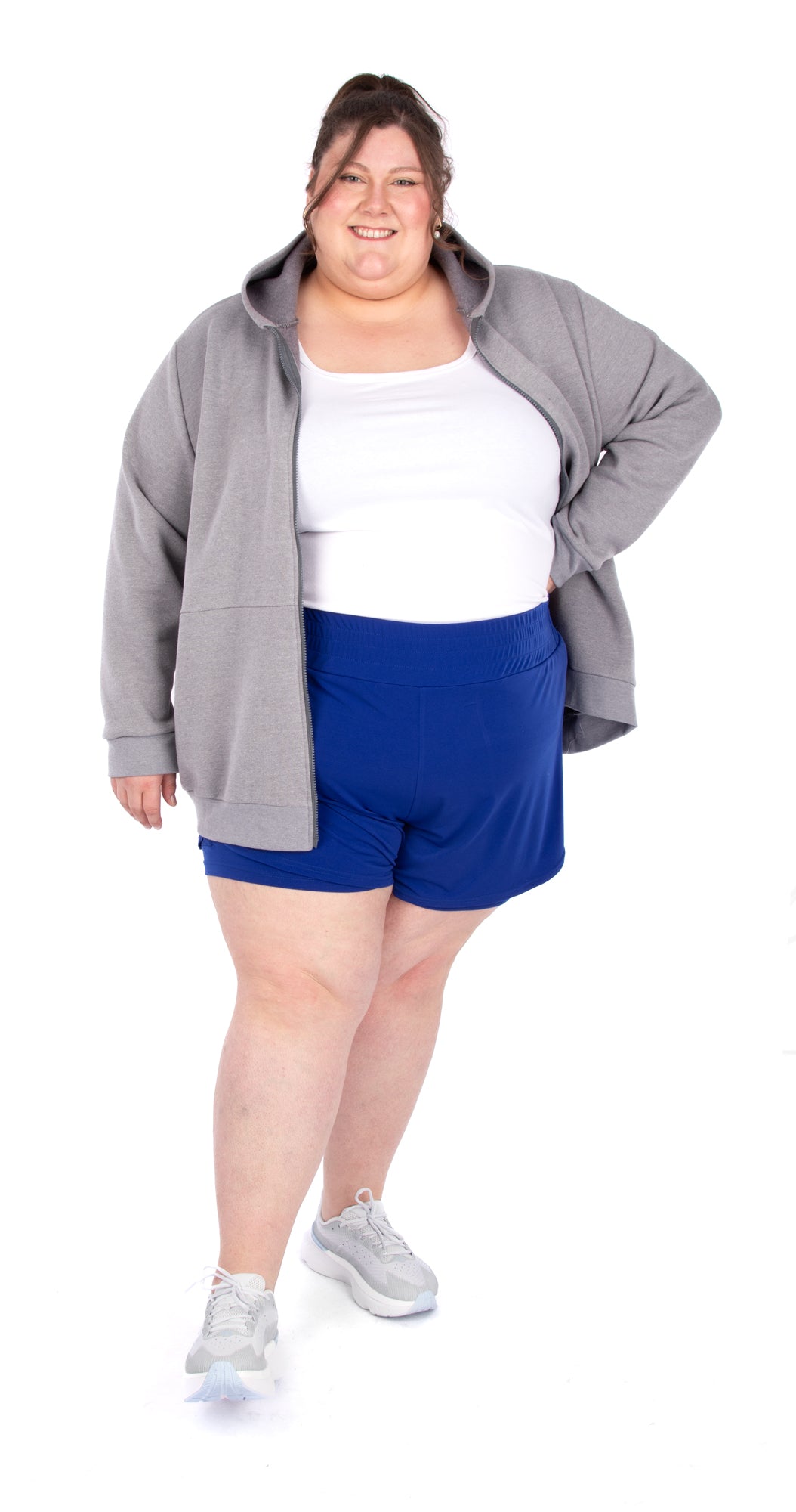 Person wearing a gray Danaëlle hoodie (4239), white tank (4135), and blue shorts (4671) on a white background
