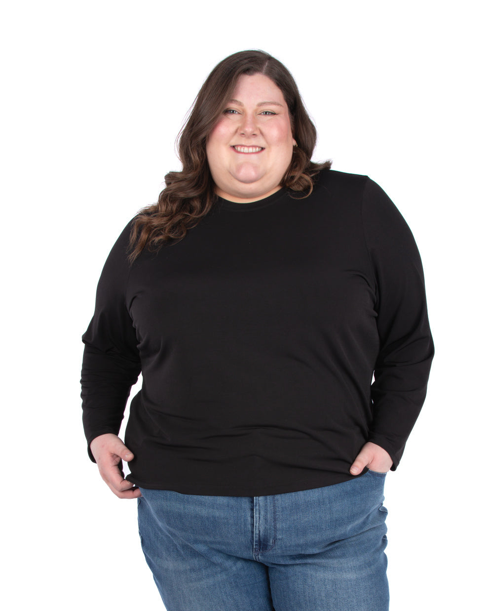 Person wearing a black long sleeve tee and blue jeans 