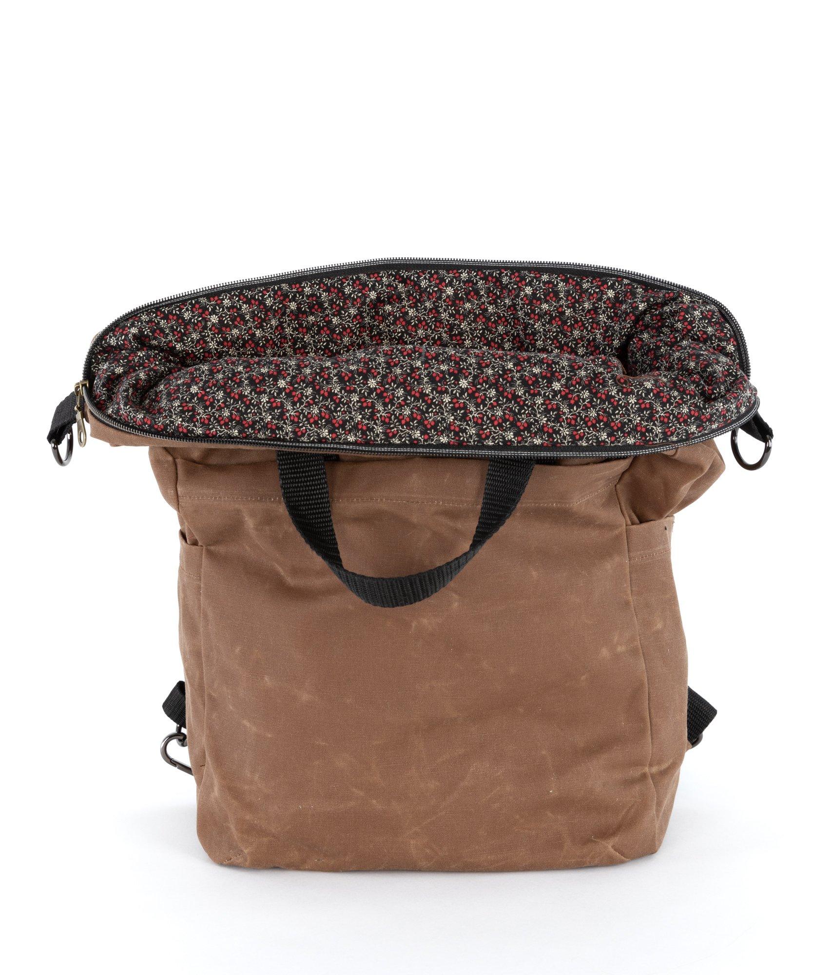 The Vega bag is fully lined. This waxed canvas bag is lined with liberty-style quilting cotton.